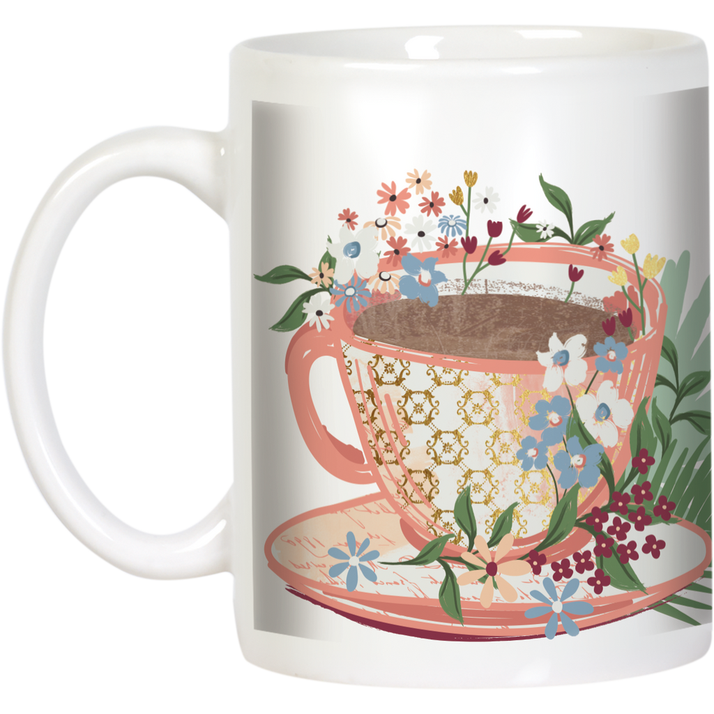 Angled side view of an aesthetic white mug showcasing a beautiful floral illustration and a delicate pink teacup graphic, ideal for a morning coffee or an afternoon tea ritual.