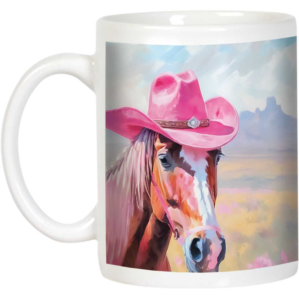 Angled view of a white ceramic mug showcasing a charming brown horse in a pink cowboy hat, with a desert and mountain background, highlighting the mug's white handle and full design.