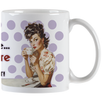 White ceramic mug featuring a retro pin-up woman with curly dark hair and red lipstick, elegantly sipping coffee from a small cup. The background has light purple polka dots.