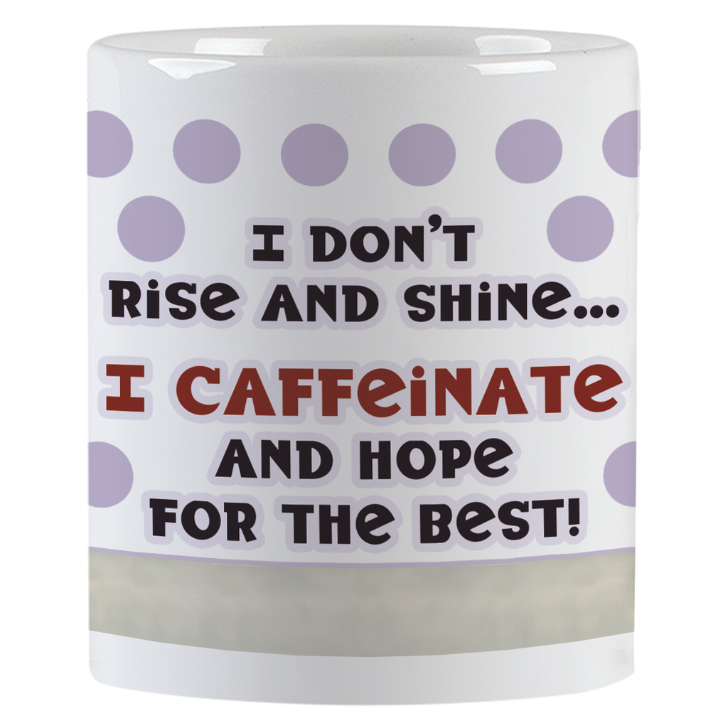 Close-up view of the white ceramic coffee mug displaying the humorous text 'I don't rise and shine... I CAFFEINATE AND HOPE FOR THE BEST!' with purple polka dots.