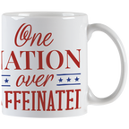Close-up of white ceramic coffee mug displaying red 'One NATION over CAFFEINATED' text with blue star accents, perfect for coffee lovers and daily use.