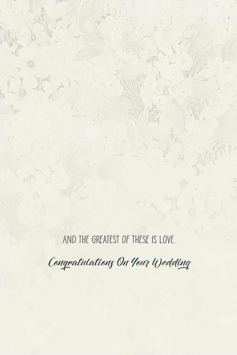 Inside of a wedding congratulations card with the text 'AND THE GREATEST OF THESE IS LOVE. Congratulations On Your Wedding'.
