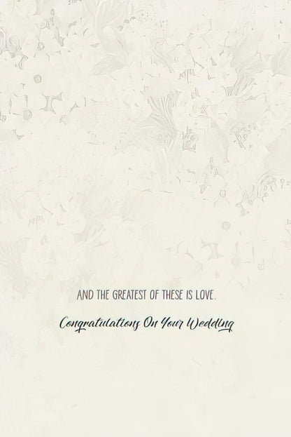 Inside of a wedding congratulations card with the text 'AND THE GREATEST OF THESE IS LOVE. Congratulations On Your Wedding'.