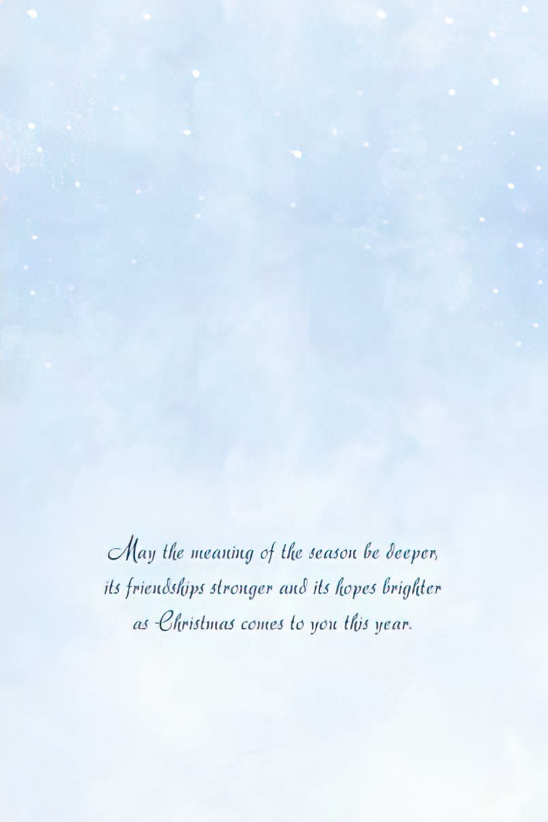 Inside of a holiday card with a light blue, ethereal background and elegant script text reading: 'May the meaning of the season be deeper, its friendships stronger and its hopes brighter as Christmas comes to you this year.'
