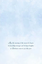 Inside of a holiday card with a light blue, ethereal background and elegant script text reading: 'May the meaning of the season be deeper, its friendships stronger and its hopes brighter as Christmas comes to you this year.'