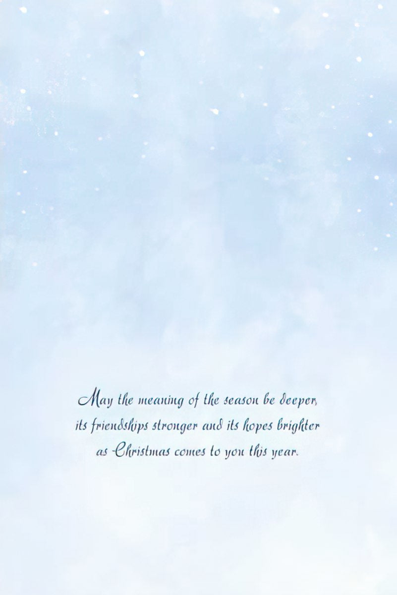 Inside of a holiday card with a light blue, ethereal background and elegant script text reading: 'May the meaning of the season be deeper, its friendships stronger and its hopes brighter as Christmas comes to you this year.'