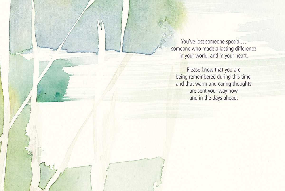 Inside of a watercolor aspen trees sympathy card with a comforting message about loss and remembrance.