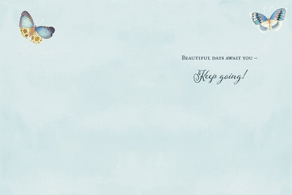 Interior of an encouragement greeting card with 'Beautiful days await you - Keep going!' message on a serene light blue watercolor wash.