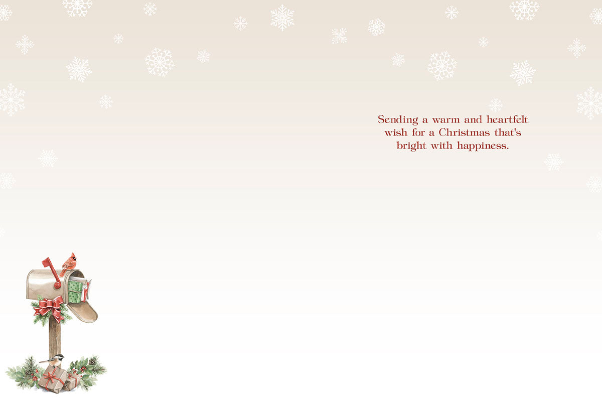 Inside of a Christmas card featuring a heartfelt holiday message and a small illustration of a decorated mailbox with birds.
