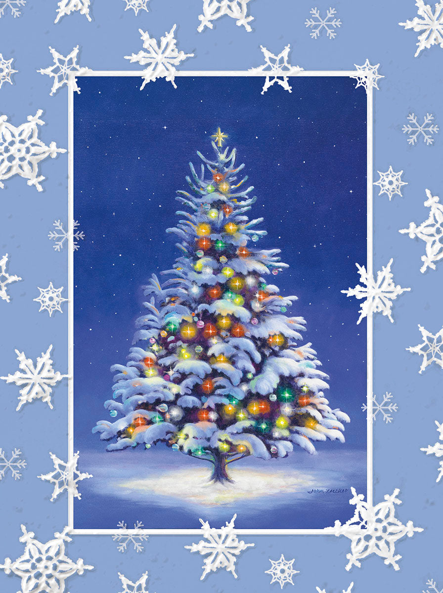 Christmas greeting card with a snow-covered, lit evergreen tree on a starry blue background, framed by white snowflakes.