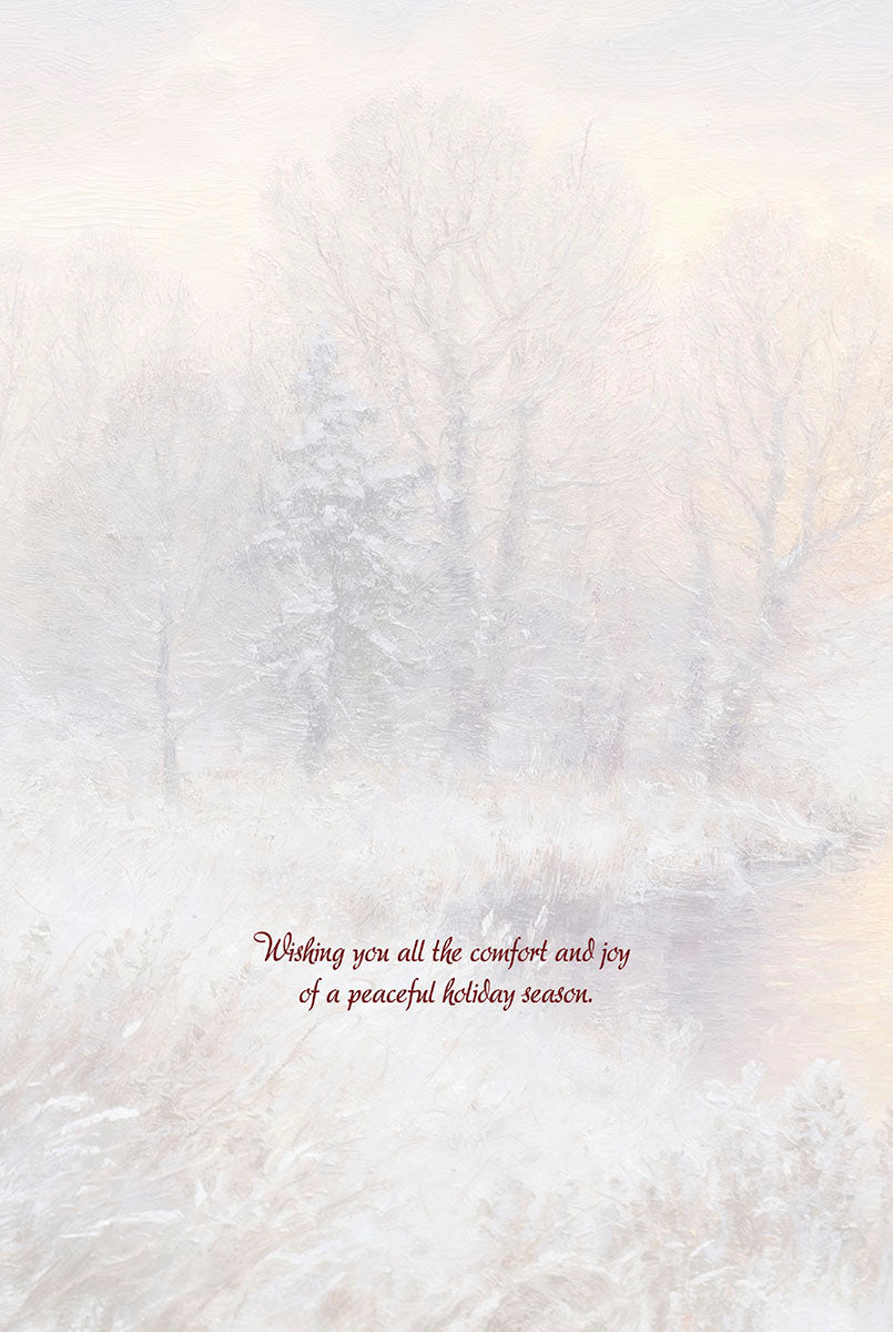 Inside of a Christmas greeting card with a serene snowy winter landscape and holiday message.