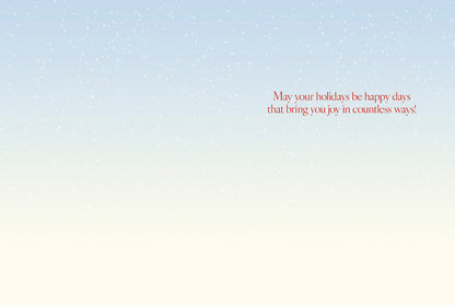 Inside of a Christmas greeting card with the message 'May your holidays be happy days that bring you joy in countless ways!'