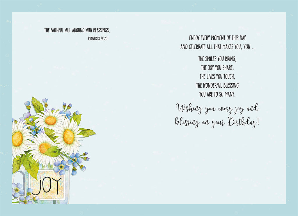 Inside view of a heartfelt greeting card displaying a message of blessings and joy, 'Wishing you every joy and blessing on your Birthday!' alongside a floral design and Proverbs 28:20. Perfect for conveying warm wishes.