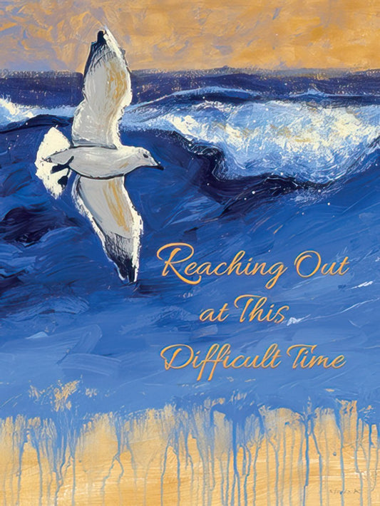 Front of a sympathy card featuring a painted seagull flying over turbulent blue ocean waves, with a message of support.