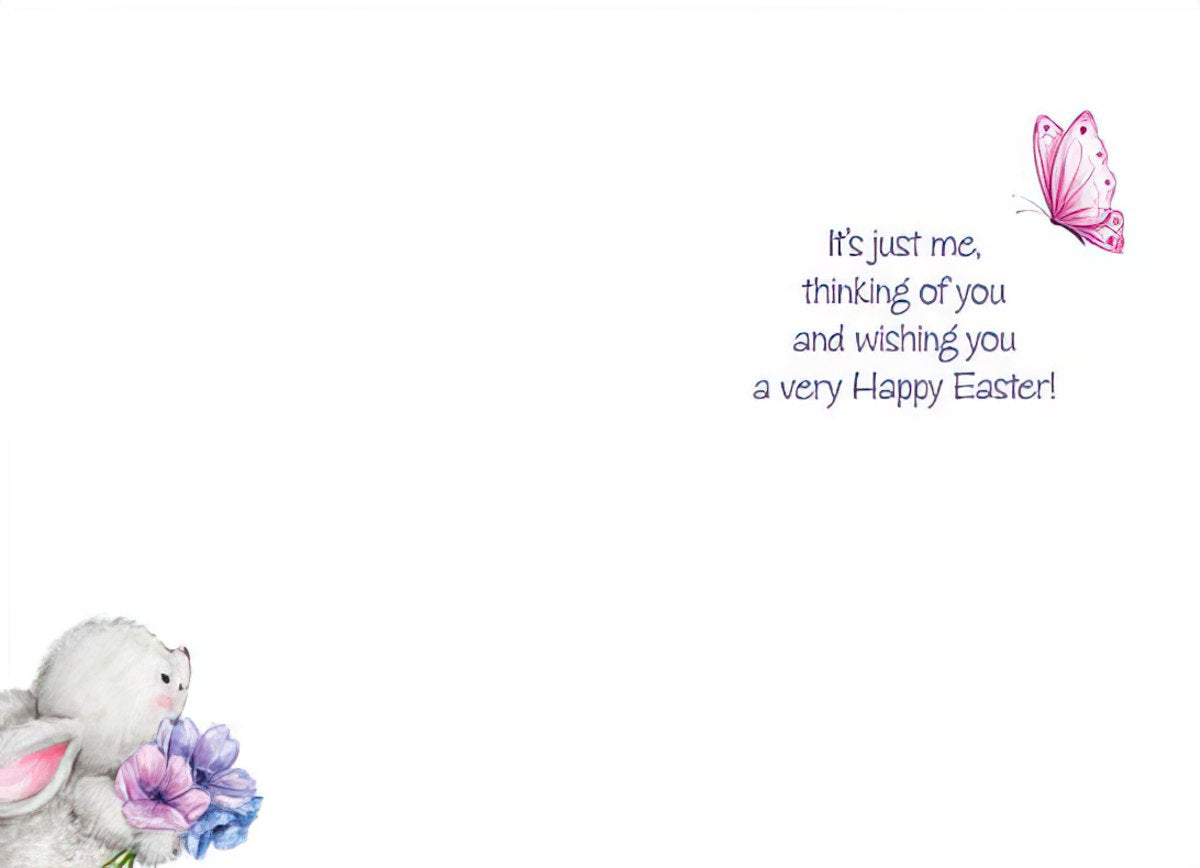 Inside of an Easter card with a white background. The message reads 'It's just me, thinking of you and wishing you a very Happy Easter!' in purple script, accompanied by a small pink butterfly icon. The bottom left corner shows a glimpse of the bunny and flowers from the front design.