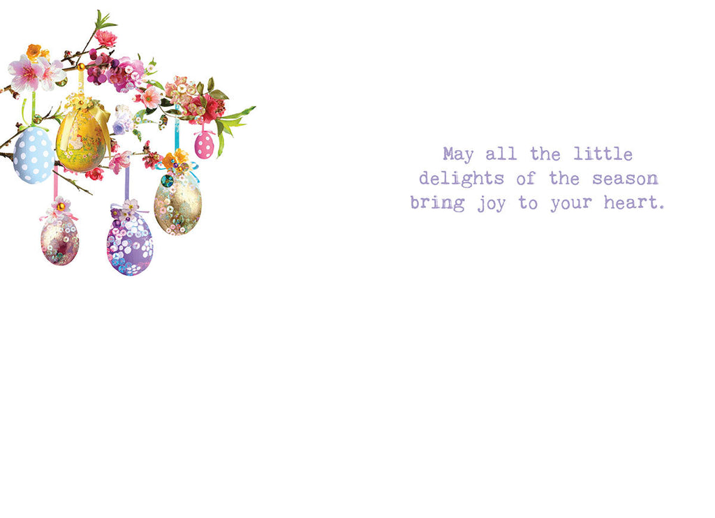 Inside of a Lighthearted Easter card showing colorful decorative eggs on a branch on the left, with a warm message: 'May all the little delights of the season bring joy to your heart.' Perfect for a friend.