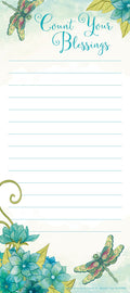 Magnetic listpad featuring 'Count Your Blessings' in elegant script, adorned with two vibrant teal and pink dragonfly illustrations and a cluster of teal watercolor flowers in the bottom left corner. The pad has ample ruled lines for notes, lists, or gratitude entries, and is designed for refrigerator or magnetic surface display.