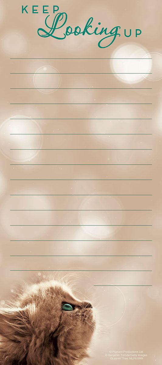 Magnetic listpad with an encouraging 'Keep Looking Up' message in green script. The design features a fluffy brown cat with vivid green eyes looking upwards, against a soft beige background with bokeh lights. Lined pages are visible for notes and lists.