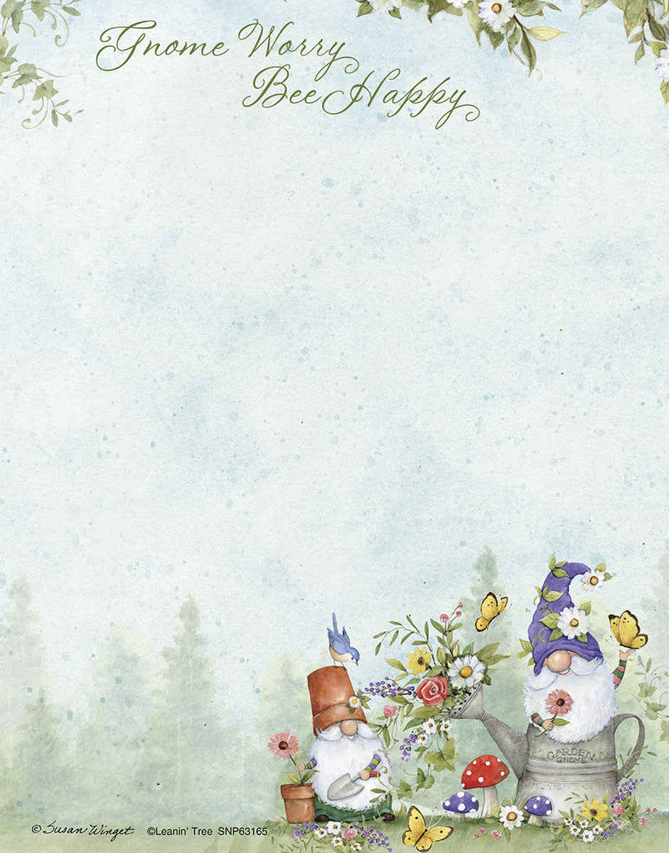 Whimsical 'Gnome Worry Bee Happy' notepad featuring two garden gnomes tending to flowers, surrounded by butterflies and mushrooms on a light blue-green background.