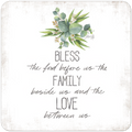 Square white coaster featuring a botanical illustration of eucalyptus leaves and the blessing text 'BLESS the food before us the FAMILY beside us and the LOVE between us' in mixed script and block fonts, with a rustic border.