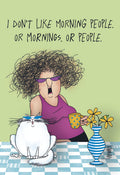 Funny cartoon fridge magnet showing a sassy woman with wild hair and purple sunglasses, holding a coffee mug, alongside a grumpy white cat wearing blue sunglasses. The text reads 'I DON'T LIKE MORNING PEOPLE. OR MORNINGS. OR PEOPLE.' on a light green background.