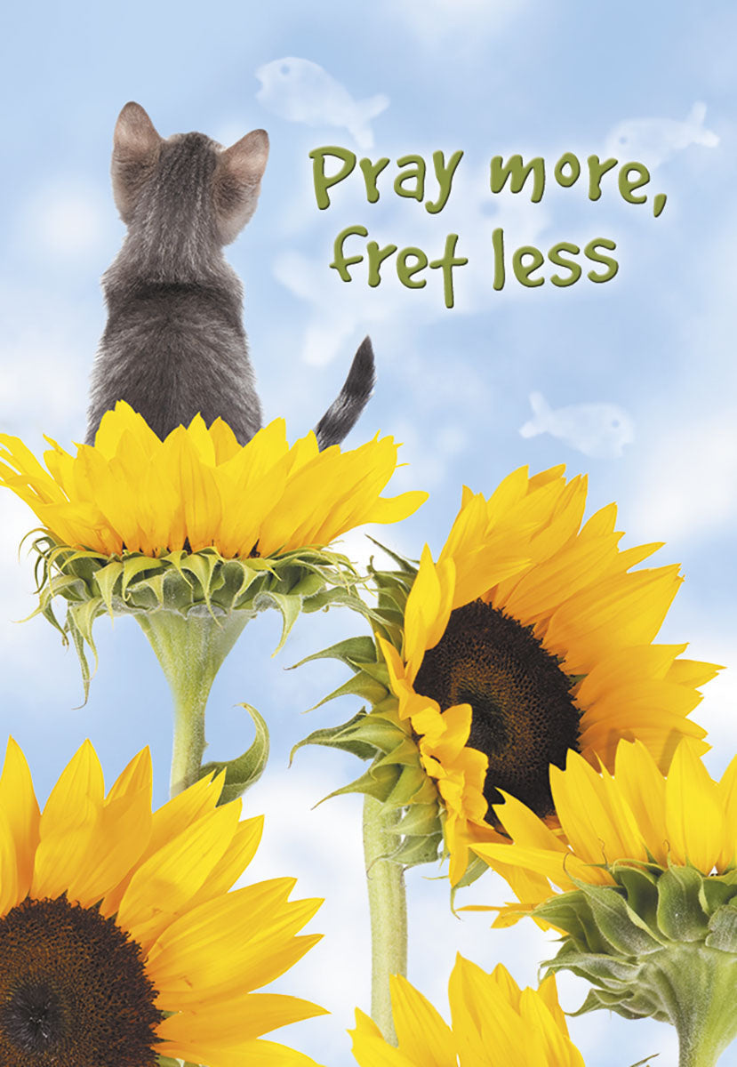 Cute gray tabby cat perched on a vibrant yellow sunflower, gazing skyward at a blue sky with faint fish shapes, alongside the inspirational text 'Pray more, fret less.' Inspirational magnet design.