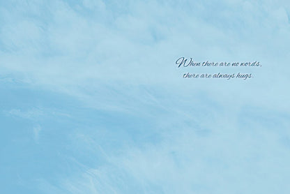 Inside of a greeting card with a light blue sky background and the message: 'When there are no words, there are always hugs.'