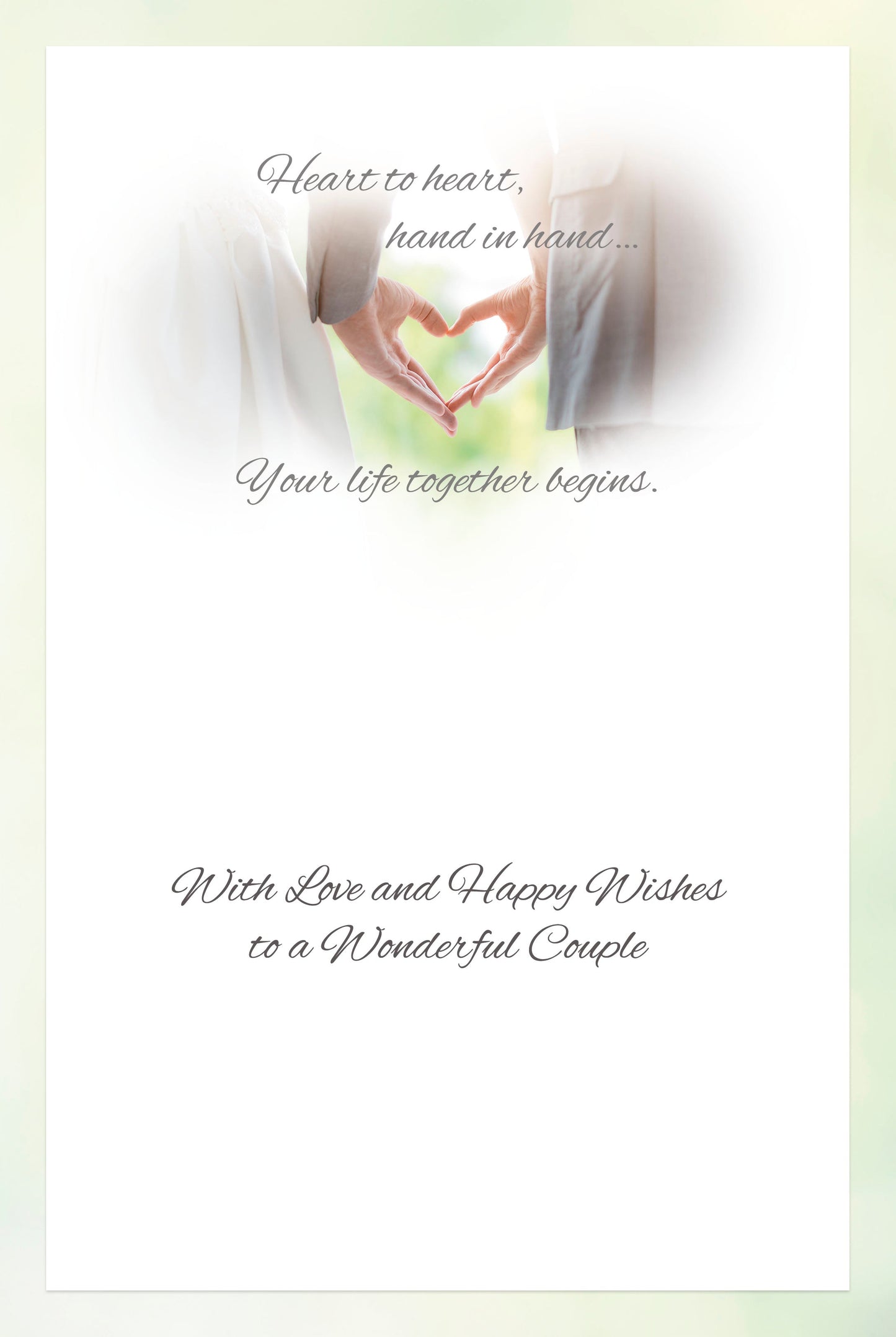 Inside of a wedding greeting card featuring a couple's hands forming a heart and heartfelt congratulatory text.