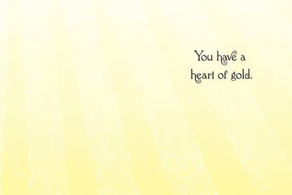 Inside of a Thank You greeting card with the message "You have a heart of gold." in elegant script on a soft yellow background.