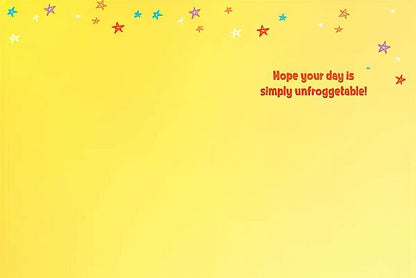 Inside of the frog birthday card, with a yellow background and colorful stars, wishing 'Hope your day is simply unfrogettable!'.