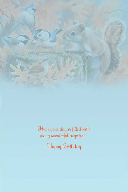 Inside of a squirrel and birds greeting card, featuring a "Hope your day is filled with many wonderful surprises! Happy Birthday" message.