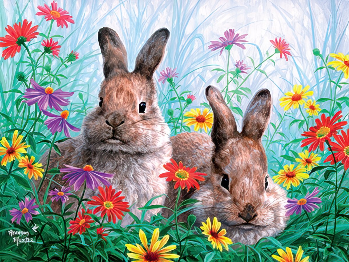 Two adorable rabbits are nestled together in a vibrant meadow filled with red, yellow, and purple wildflowers.
