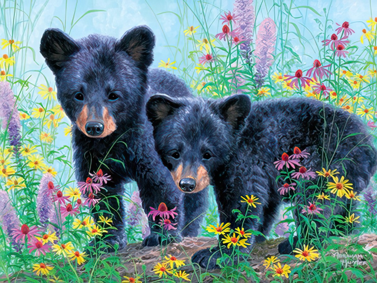 Two playful black bear cubs stand amidst a lush field of colorful purple and yellow wildflowers.