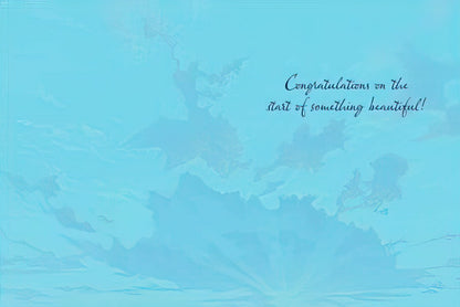 Inside of a wedding greeting card with a light blue background and the script message 'Congratulations on the start of something beautiful!'.