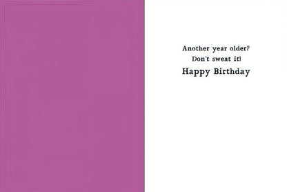 Inside of a birthday card with text 'Another year older? Don't sweat it! Happy Birthday' against a white and purple background.