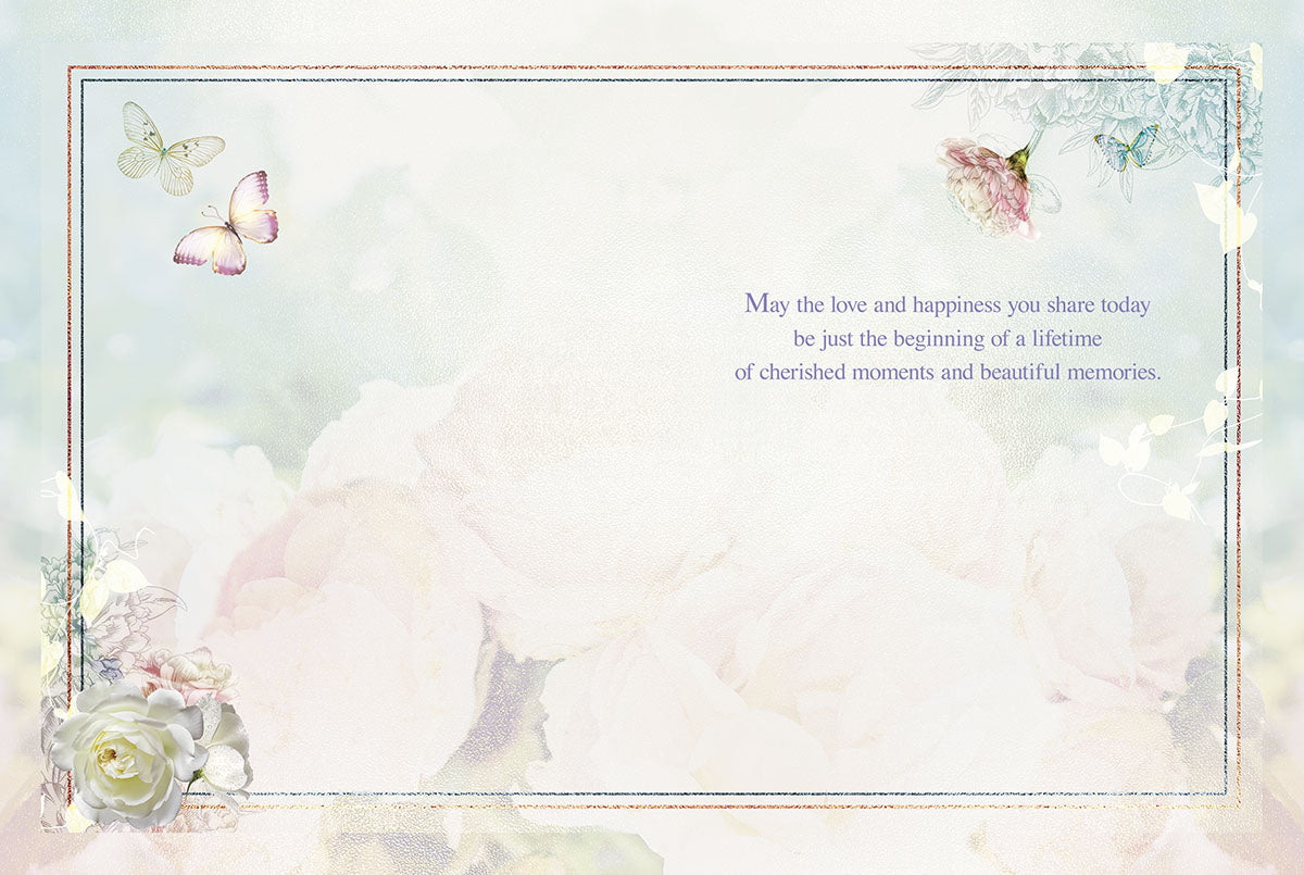 Inside an elegant wedding congratulations card with flowers and butterflies, showing a heartfelt message and ample writing space.