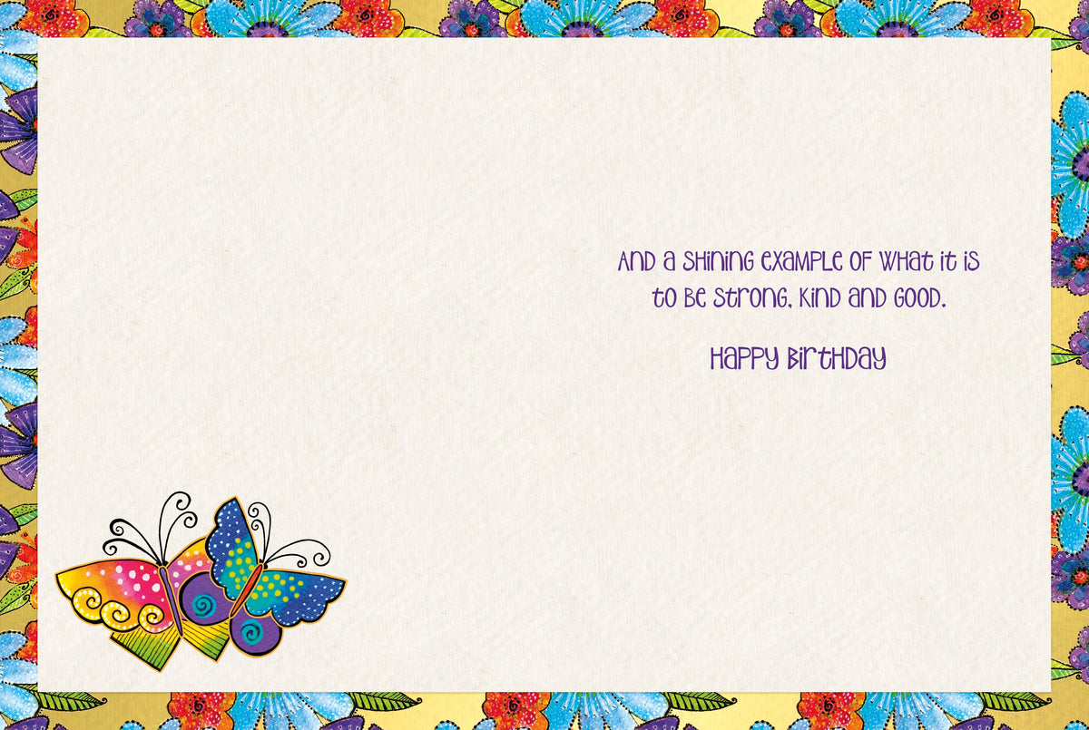 Inside of an uplifting card for friends, displaying a gold-textured background with colorful floral accents. Text reads: 'And a shining example of what it is to be strong, kind and good. Happy Birthday.'
