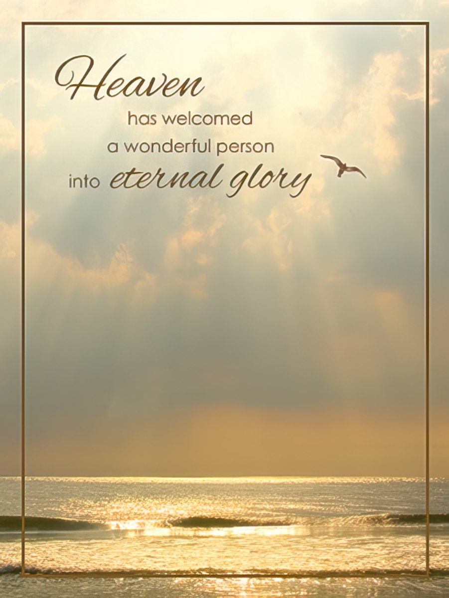Front of religious sympathy card with 'Heaven has welcomed a wonderful person into eternal glory' over a peaceful ocean and sky scene with a flying bird.