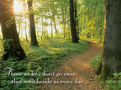 Sympathy card featuring a solitary, majestic tree in a lush green field with a fence and glowing sun.