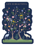 SEO-optimized alt description for a sticker featuring two stylized trees with blooming pink, yellow, orange, and blue flowers, green leaves, small birds, and butterflies, against a deep navy blue background. Two elegant white cranes stand on green ground below, and the text 'LIFE IS BEAUTIFUL' is prominently displayed at the top, conveying a positive and nature-inspired message.
