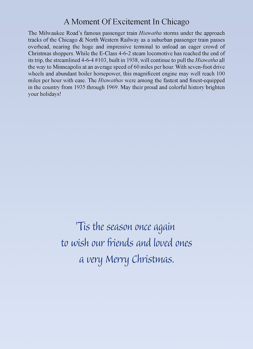 Inside view of a holiday greeting card featuring elegant script text: 'Tis the season once again to wish our friends and loved ones a very Merry Christmas, alongside a historical description of the Hiawatha train.
