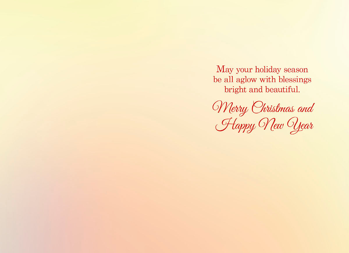 Inside of a holiday greeting card with elegant red script text: 'May your holiday season be all aglow with blessings bright and beautiful. Merry Christmas and Happy New Year', on a subtle light yellow and pink gradient background.