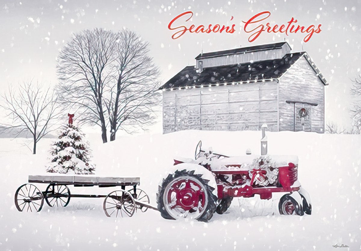 red tractor by white barn on snowy farm