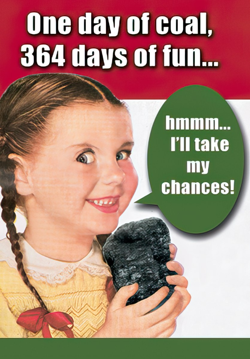 funny little girl holding chunk of coal