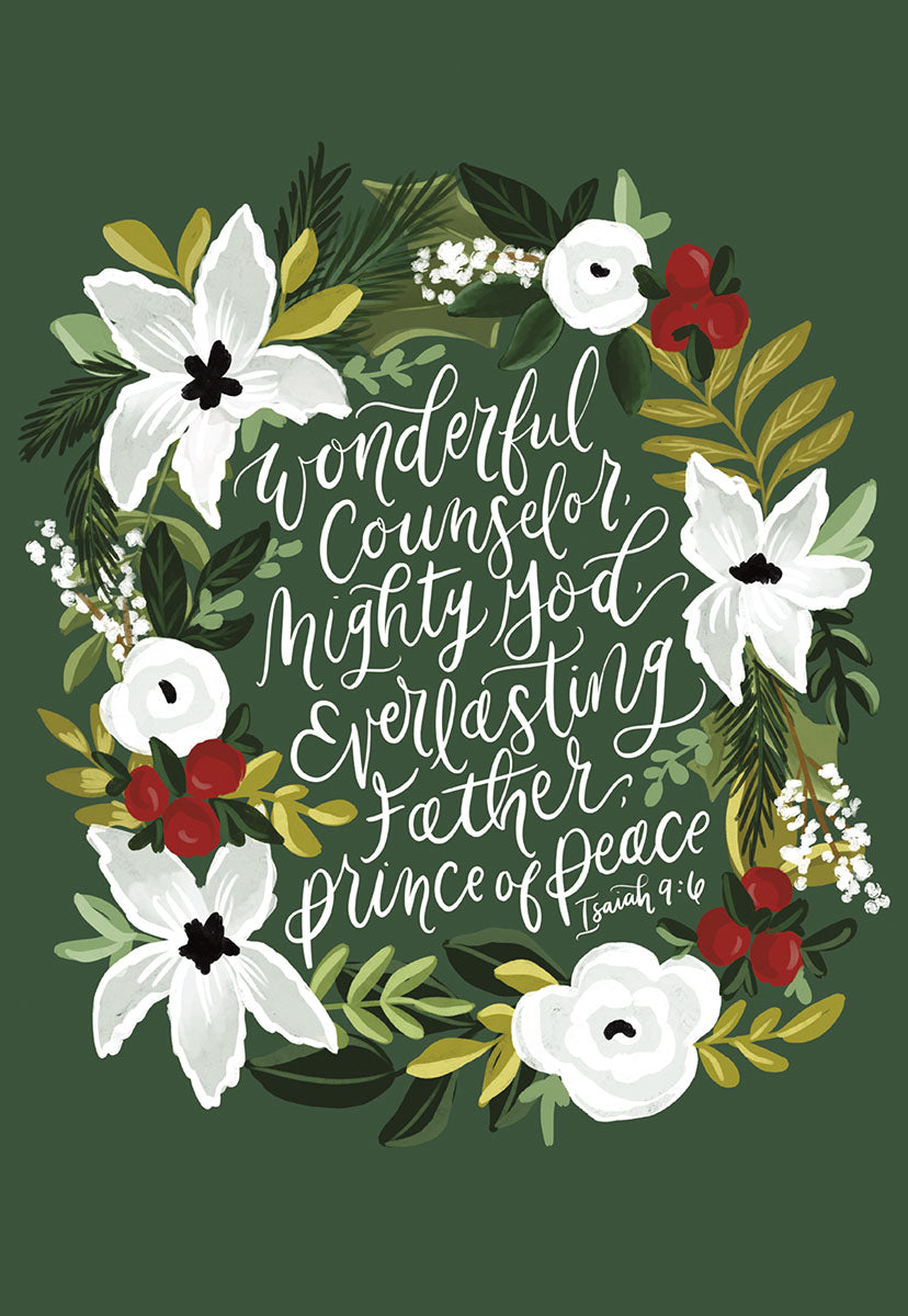 Front of a religious greeting card featuring a festive watercolor wreath with white poinsettias, red berries, and green leaves on a deep green background, surrounding white calligraphy of Isaiah 9:6: 'Wonderful Counselor, Mighty God, Everlasting Father, Prince of Peace.'
