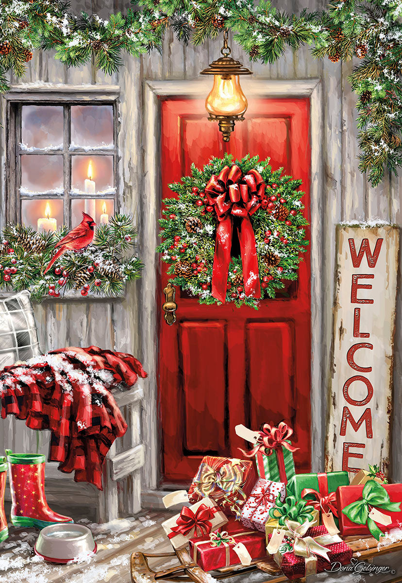 Beautiful Christmas greeting card featuring a cozy winter scene with a red front door, snow-covered porch, festive evergreen wreath with red bow, gifts, a red cardinal, and glowing lantern. Perfect for spreading holiday cheer.