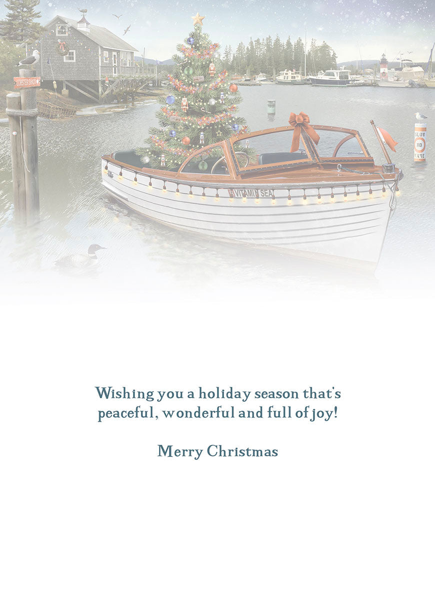Inside of a holiday greeting card with a heartfelt message in dark blue text: 'Wishing you a holiday season that's peaceful, wonderful and full of joy! Merry Christmas' on a white background.