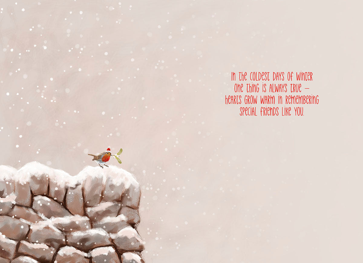 Inside of a holiday card showing a snowy scene with a robin and a heartfelt message for a special friend.