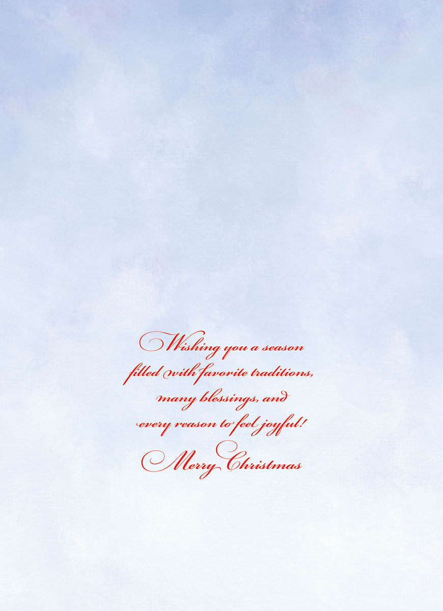 Inside of a greeting card with a soft blue background and red script text that reads: 'Wishing you a season filled with favorite traditions, many blessings, and every reason to feel joyful! Merry Christmas.'