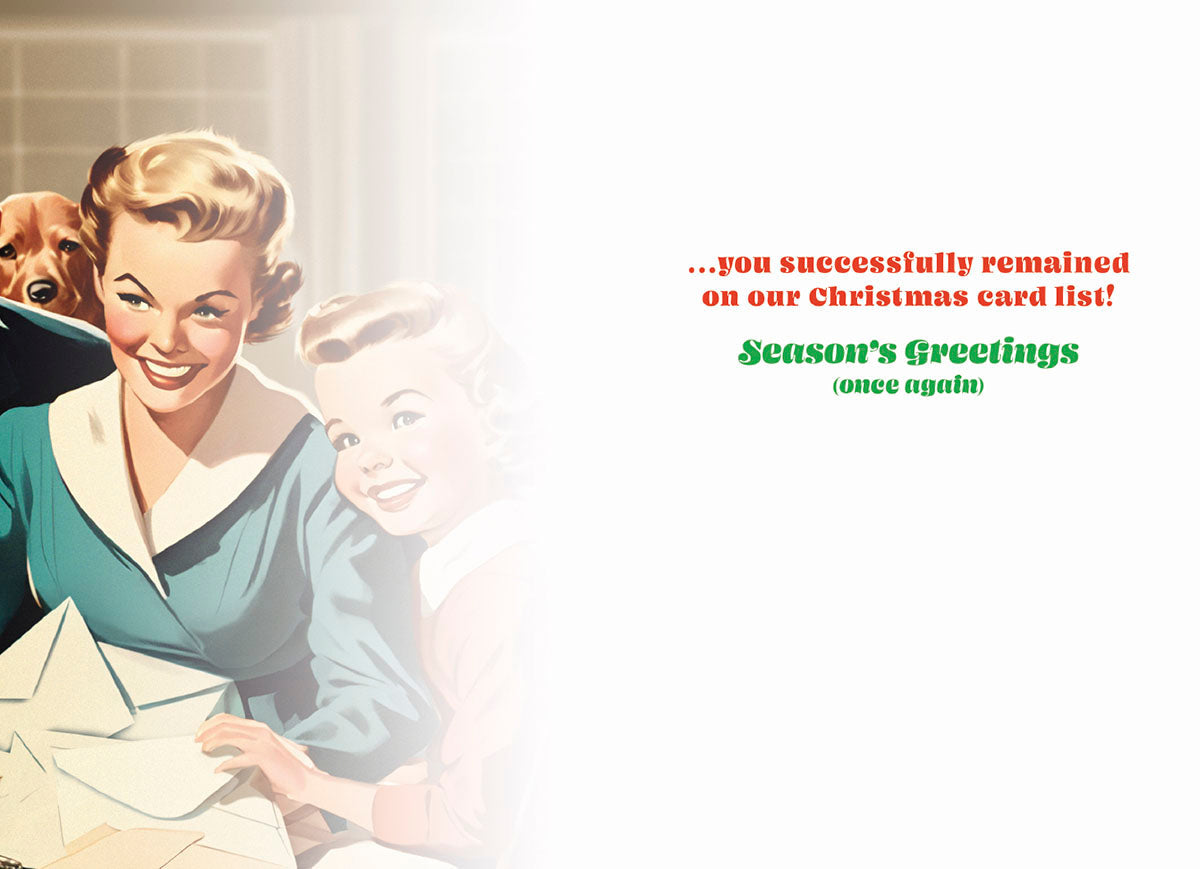 Inside of a funny holiday card showing a retro 1950s mom and child smiling while writing cards. Features humorous text: '...you successfully remained on our Christmas card list! Season's Greetings (once again)'.